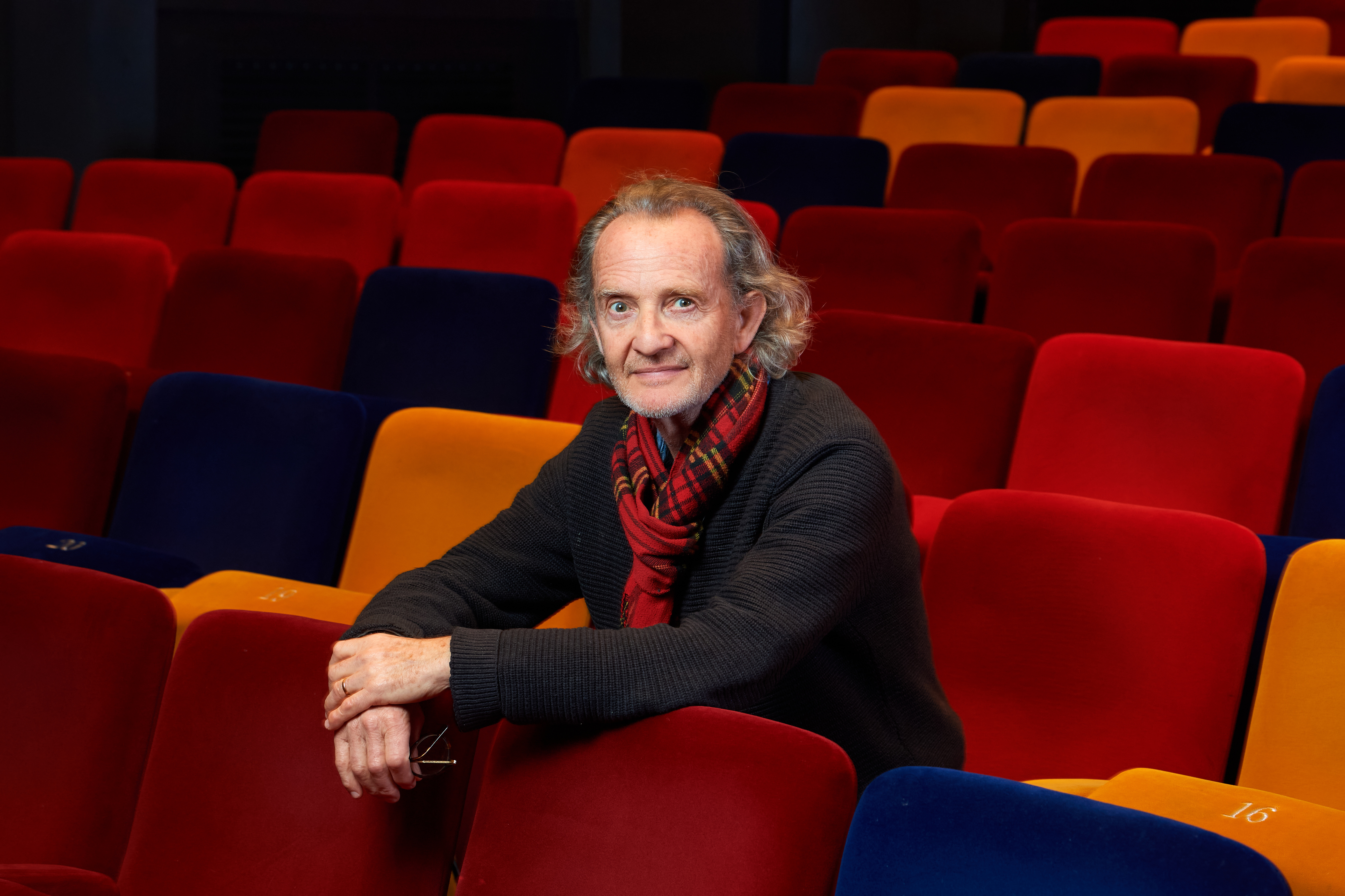 Anton Lesser sat in the Oxford Playhouse auditorium with his hands over the seat in front of him.
