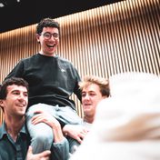 Company cast in rehearsals.