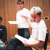 Company cast in rehearsals