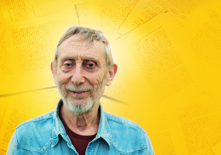 Michael Rosen in a denim button up shirt against a bright yellow background.