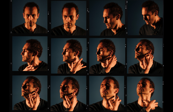 Multiple images of Khalid Abdalla in an almost stop motion film strip of him facing the camera, moving to a portrait side profile and reaching up with his hand grasping his neck.