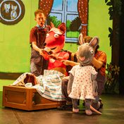 Fox and Rat in their pajamas having a cup of tea.