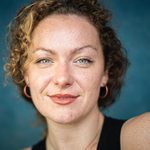 Amy Vicary Smith profile image against a blue background.