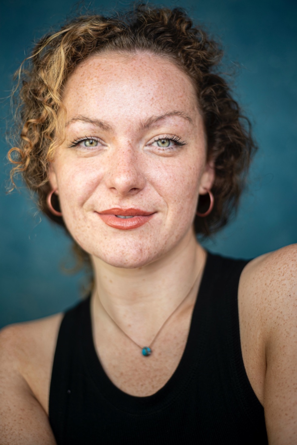 Amy Vicary Smith profile image against a blue background.