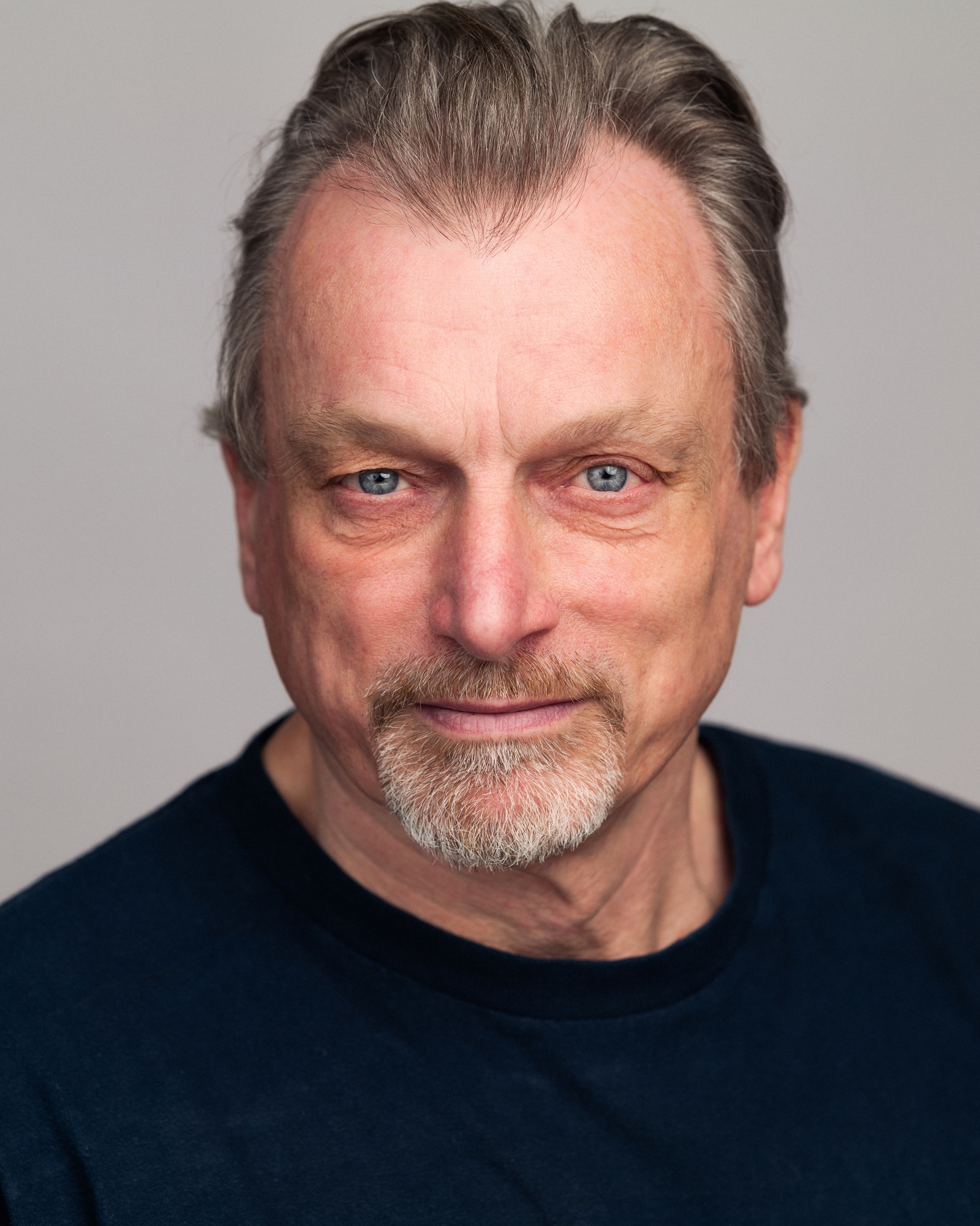 Philip Rham profile image against a grey background.