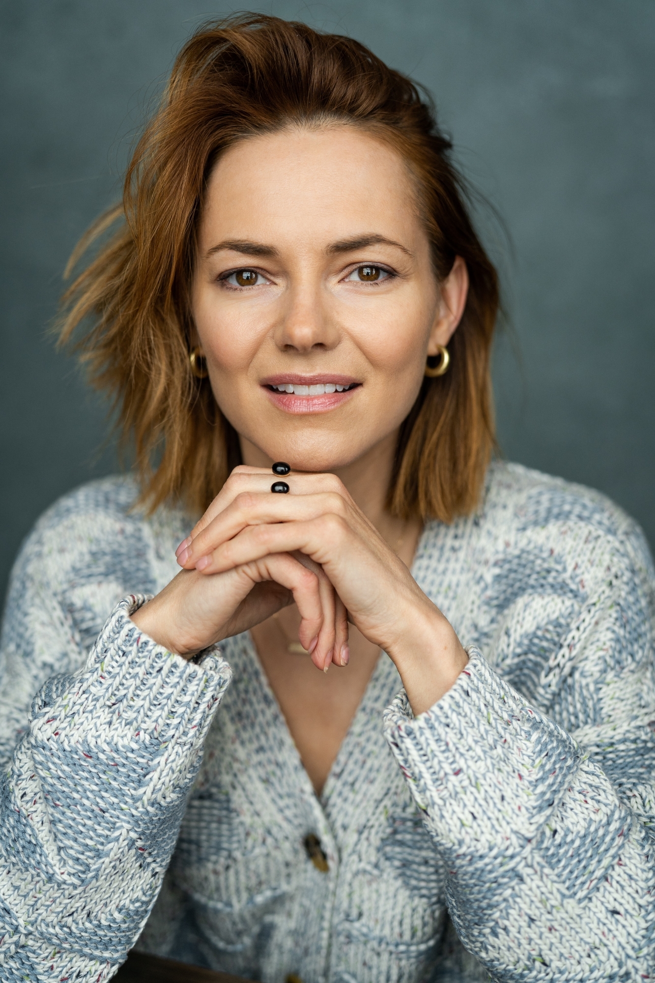 Kara Tointon profile image against a dark blue-grey background.