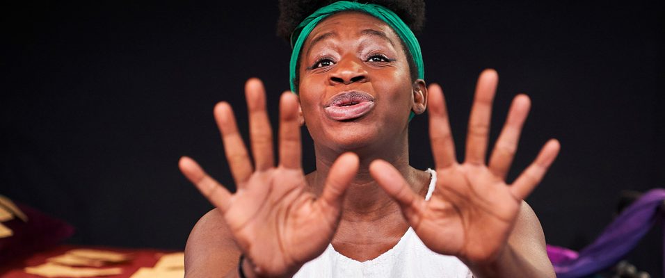 Close up of woman with hands spread out in front of her