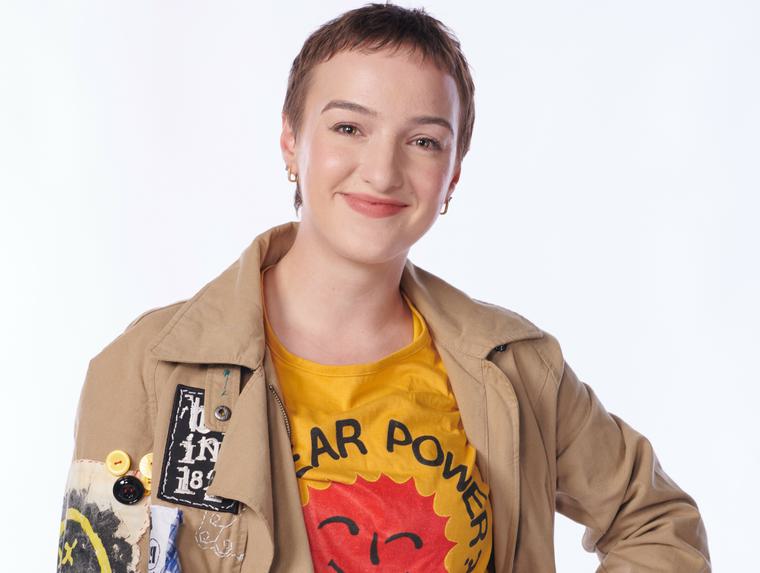 Heather Porte wearing a hippie style outfit with her hand on her hip.