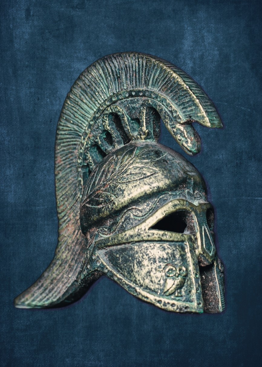 An image of a silver roman helmet with a dark blue background