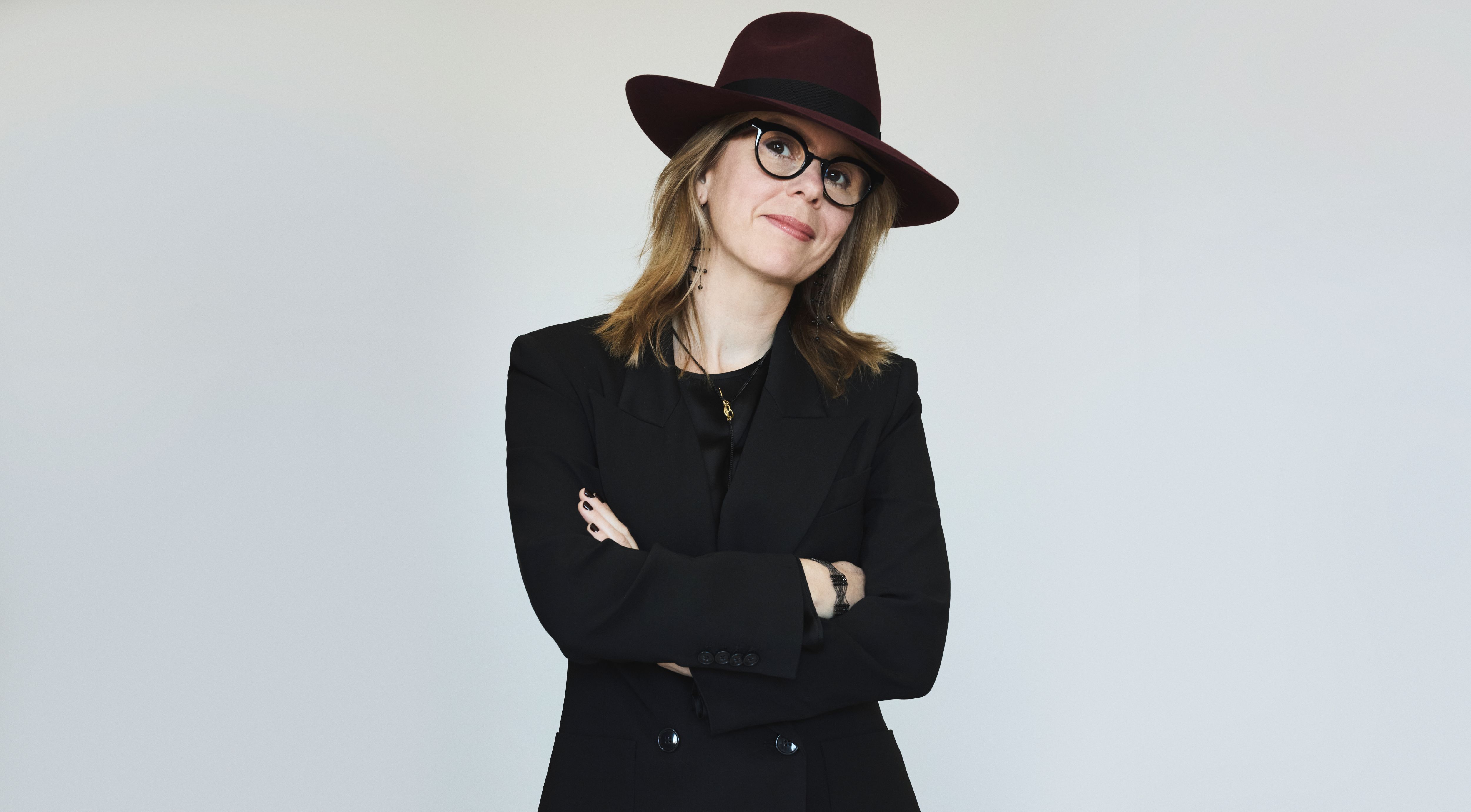 Performer wearing a hat and looking at camera