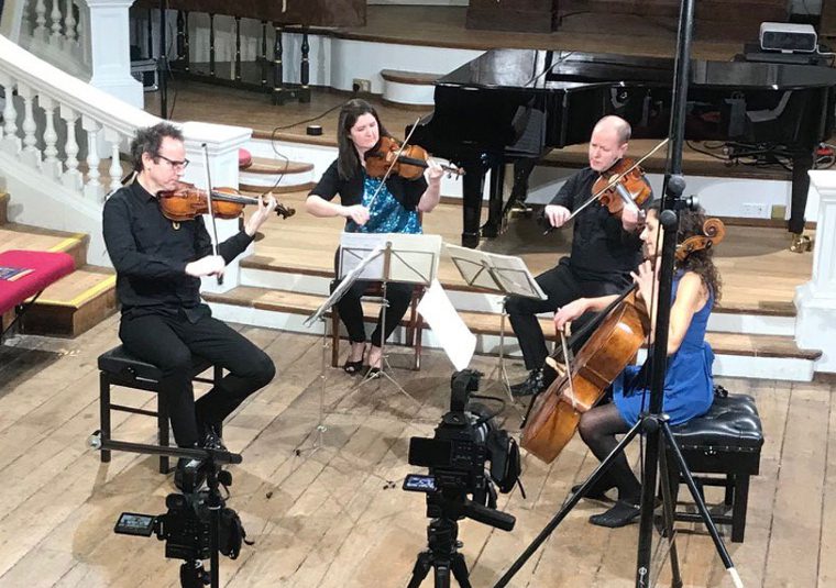 Performers playing instruments in the Holywell Music Room