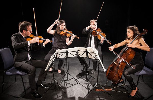 The performers playing their instruments