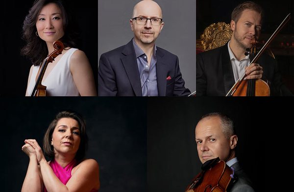 The performers facing the camera, some of them holding instruments