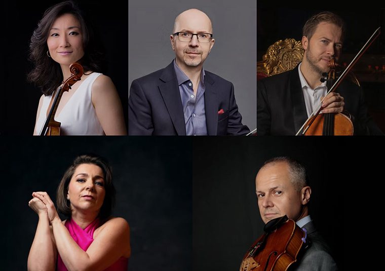 The performers facing the camera, some of them holding instruments