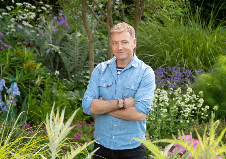 Chris Beardshaw in a garden
