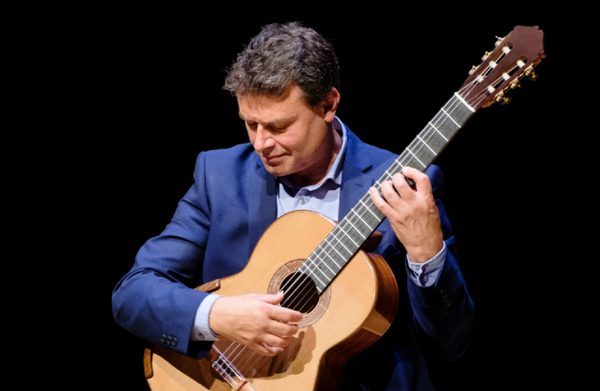 The performer holding an instrument
