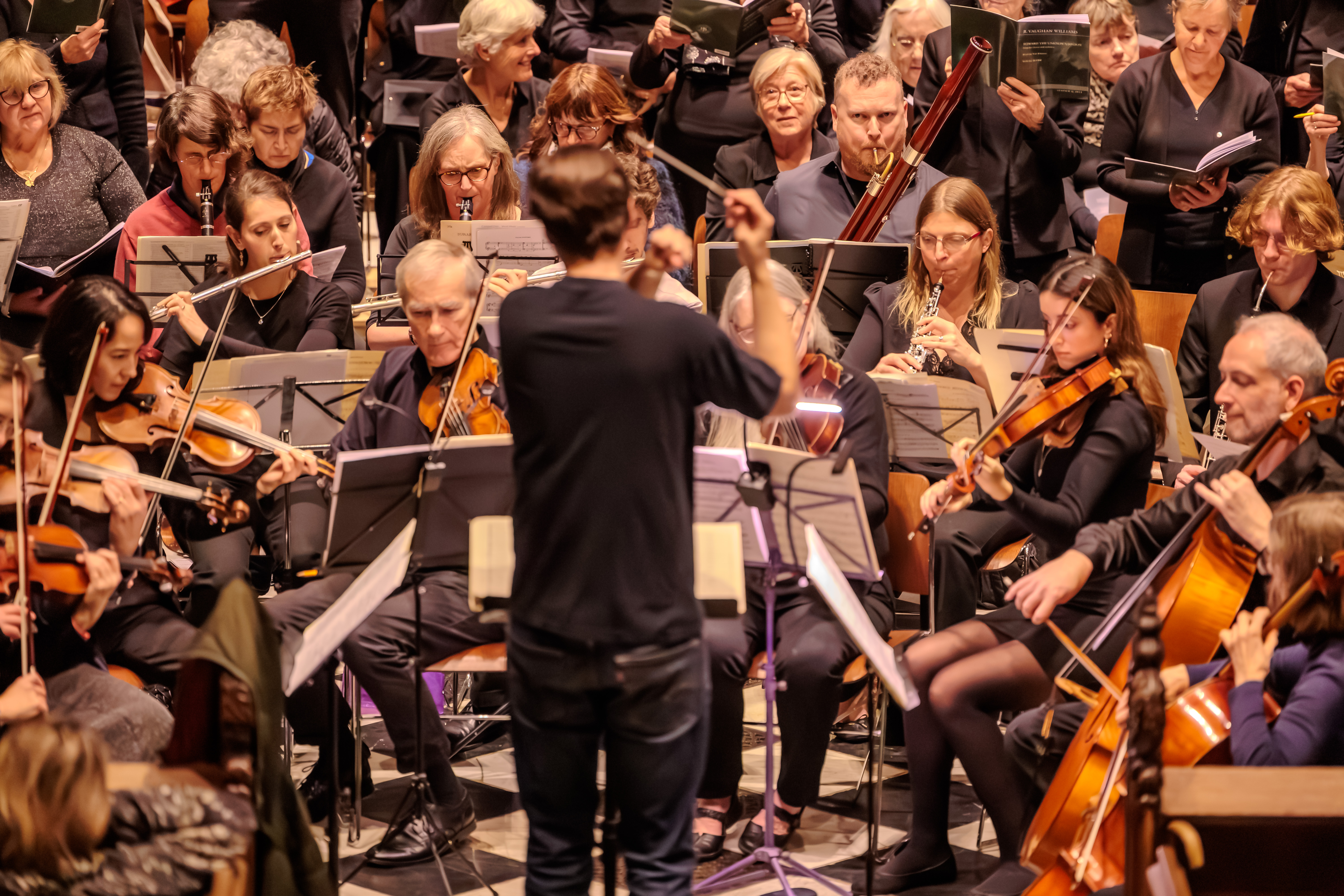 The orchestra performing with their instruments