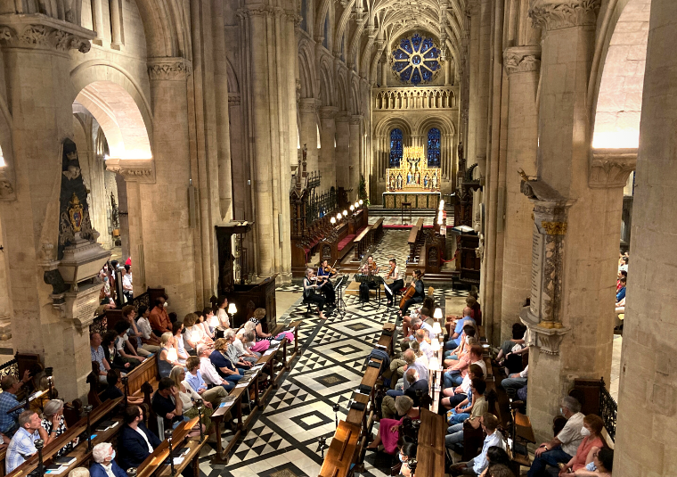 A group of musicians performing in Christ Church Cathedral.