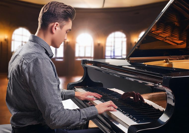 A performer playing the piano