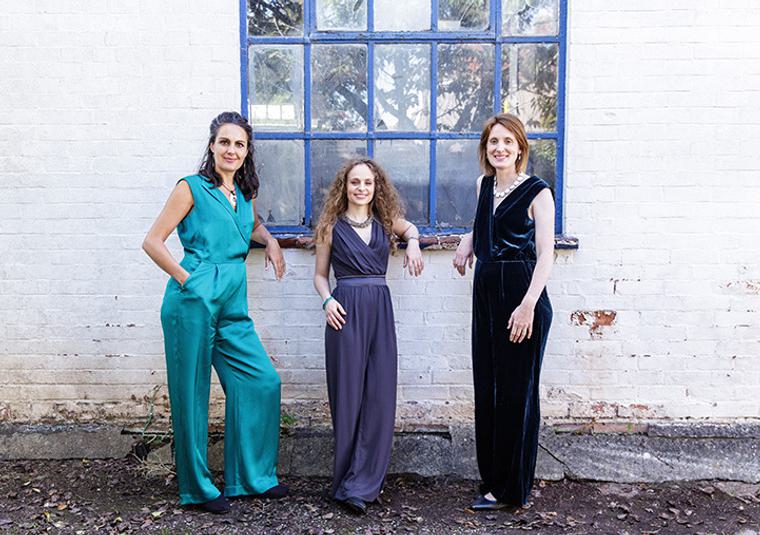 Performers standing in front of window